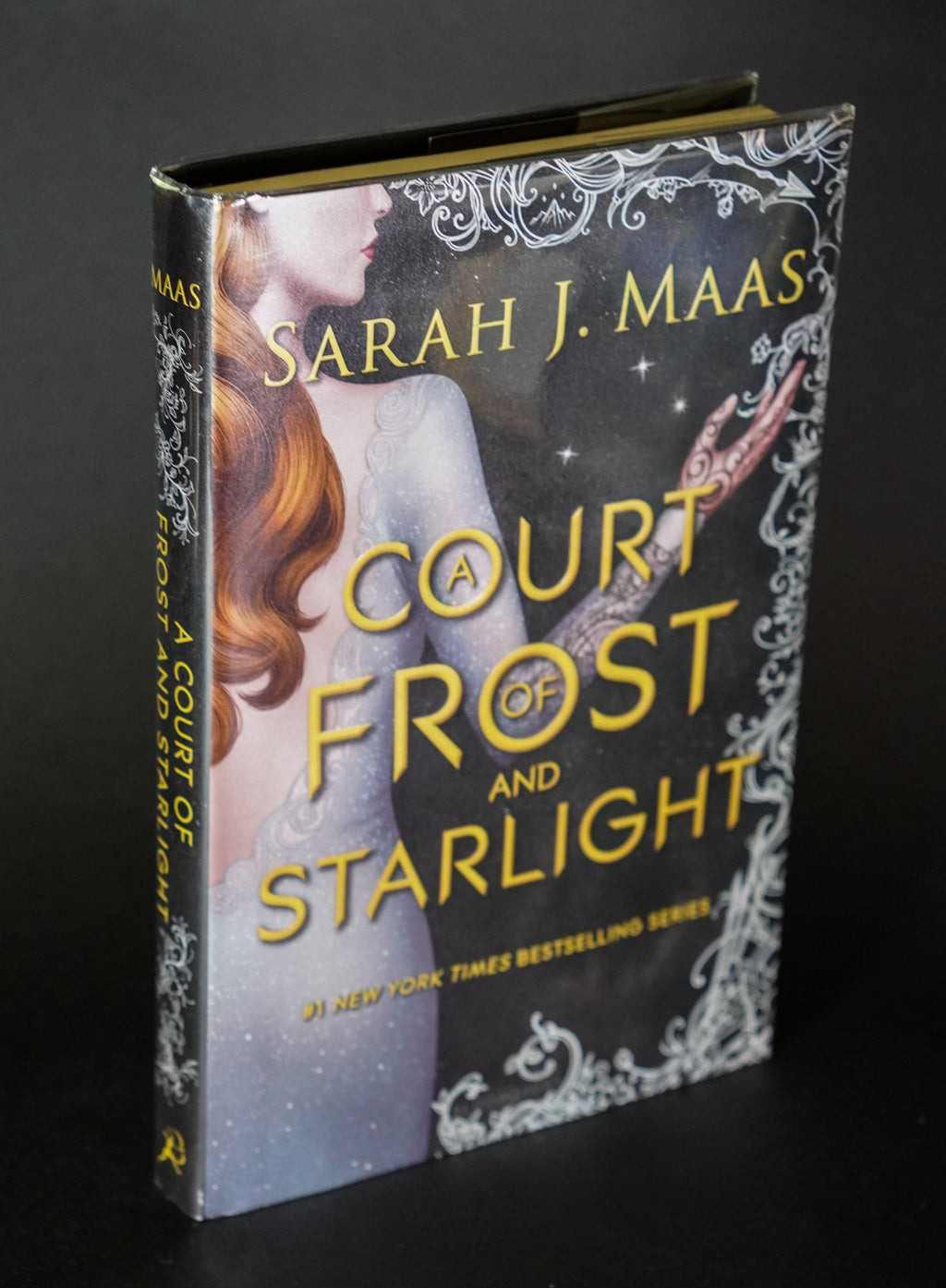A Court of Frost and Starlight original-cover first-edition hardcover front cover