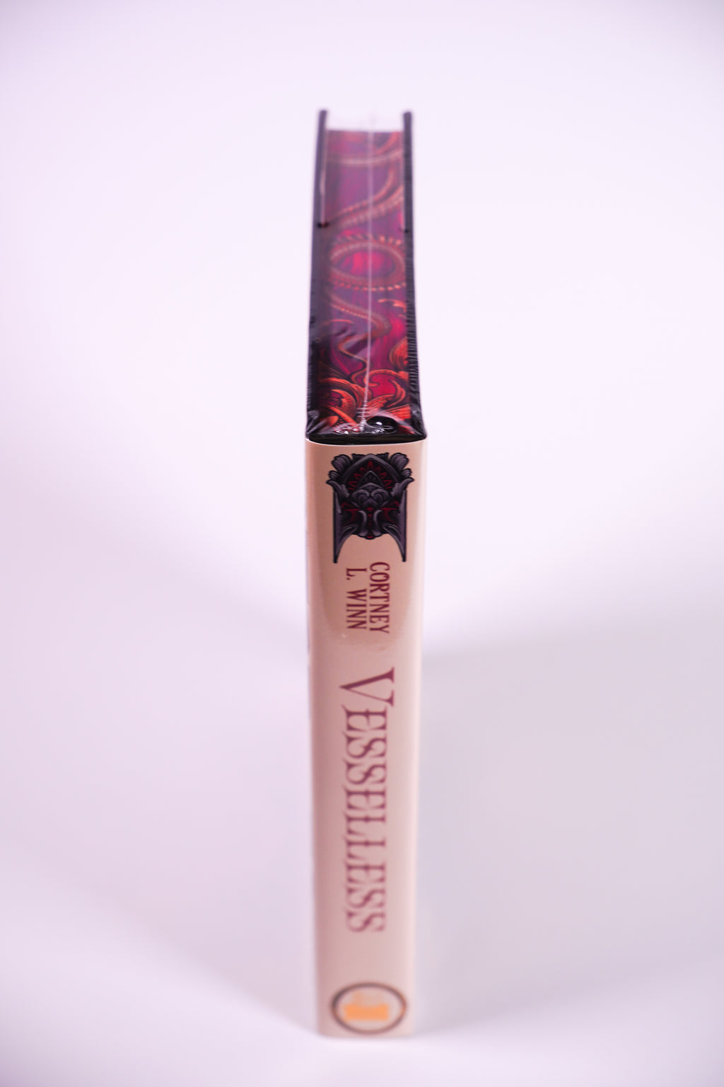Vesselless by Cortney L. Winn — spine and decorated top edge, in plastic wrap