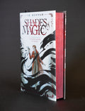 A Darker Shade of Magic Wraithmarked edition upright, showing the illustrated cover and metallic red page edges