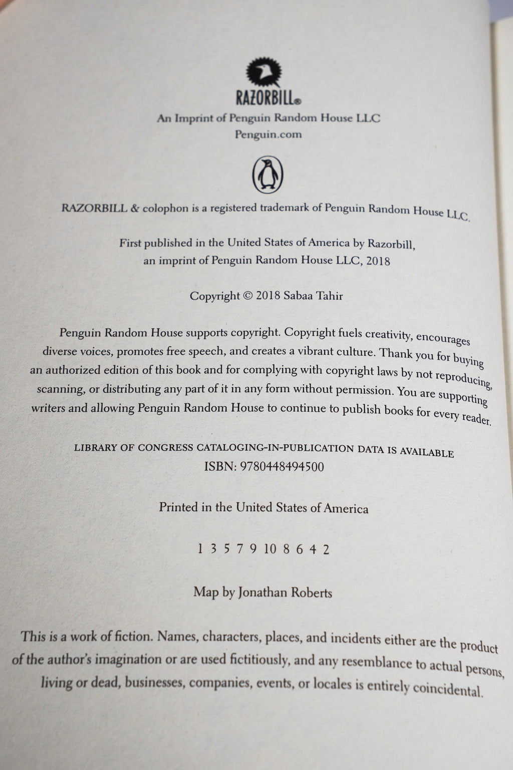 A Reaper at the Gates copyright page showing RazorBill ISBN and number line