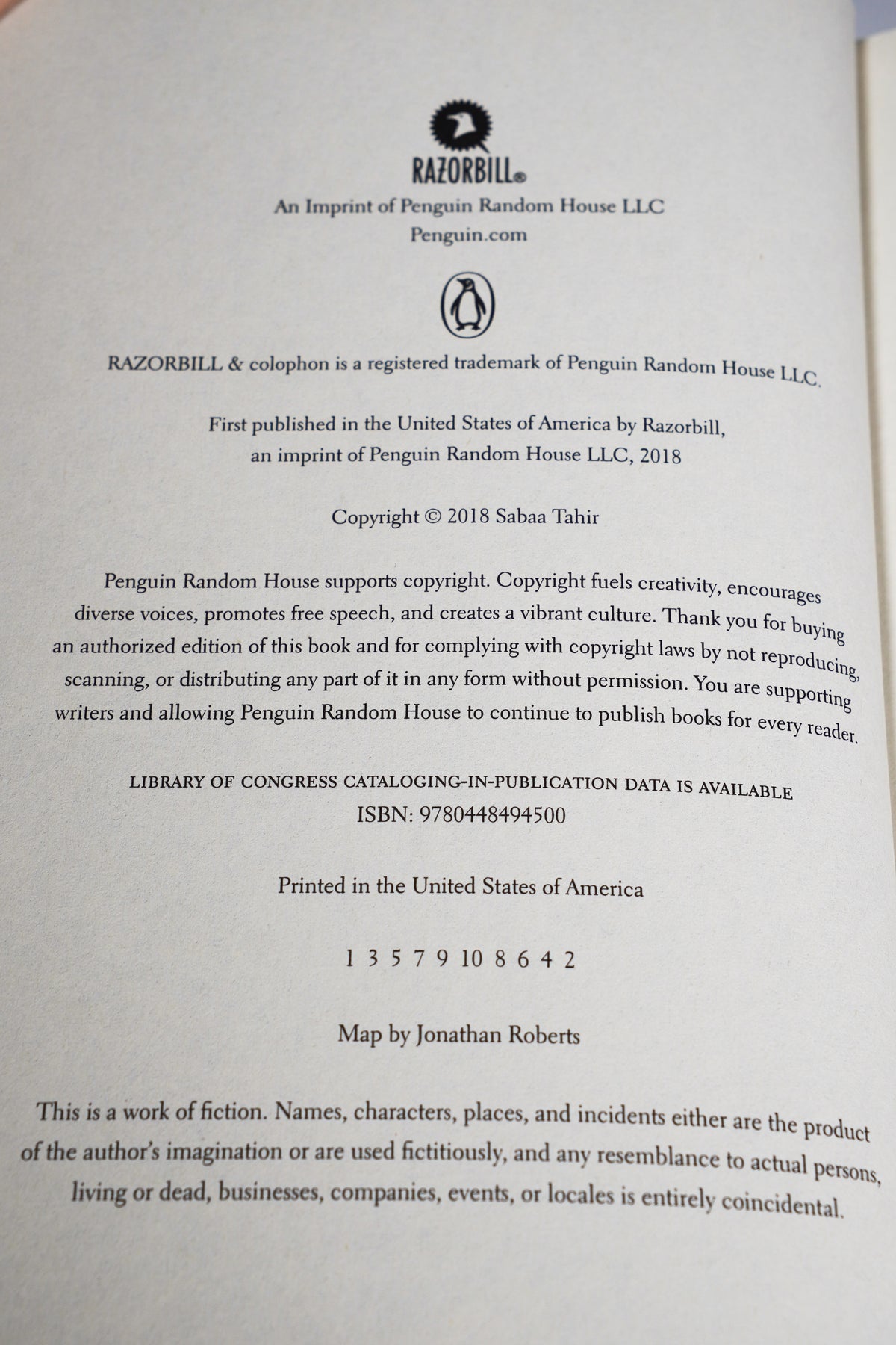 A Reaper at the Gates copyright page showing RazorBill ISBN and number line