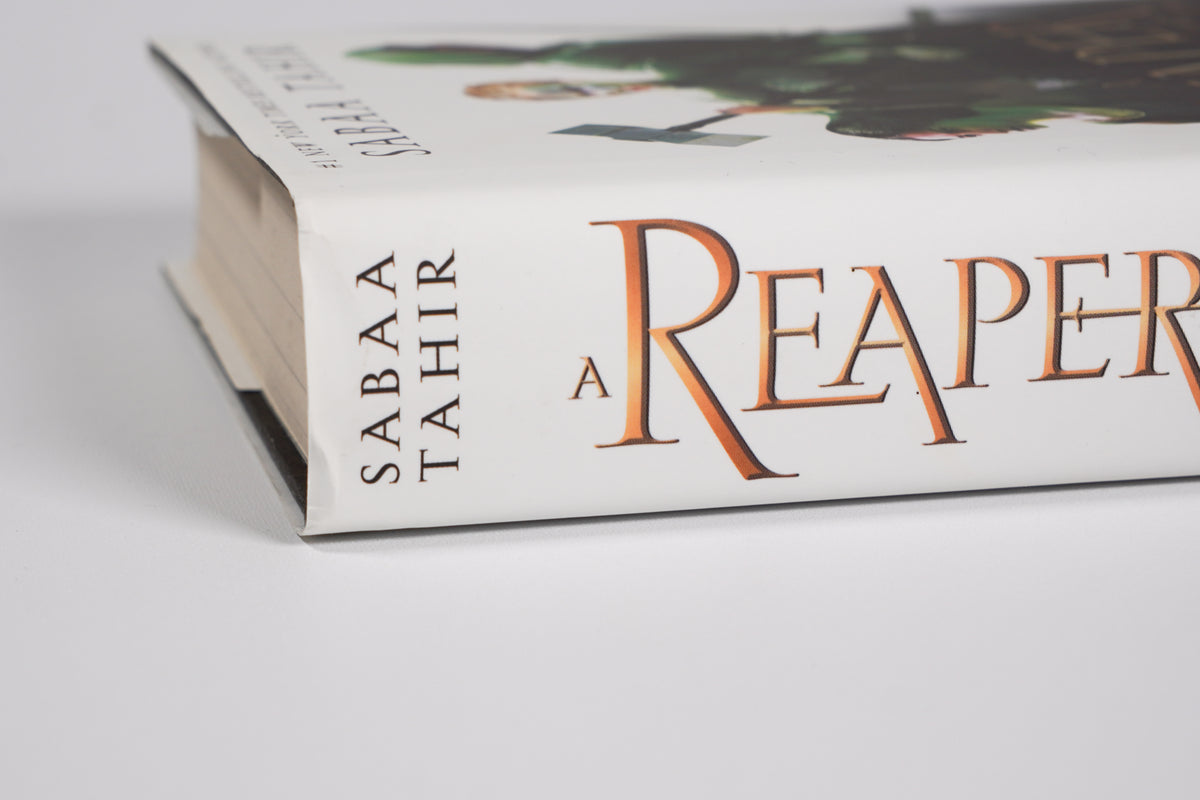 A Reaper at the Gates dust-jacket spine and upper-edge condition detail