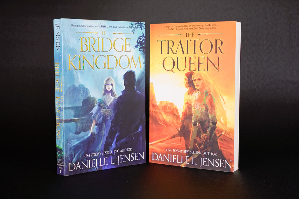 The Bridge Kingdom and The Traitor Queen — original-cover paperback pair: both front covers; actual copy