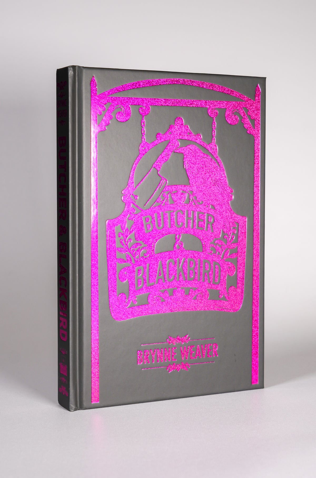 Pink foiled hardcase front on Butcher and Blackbird Bookish Box Luxe edition