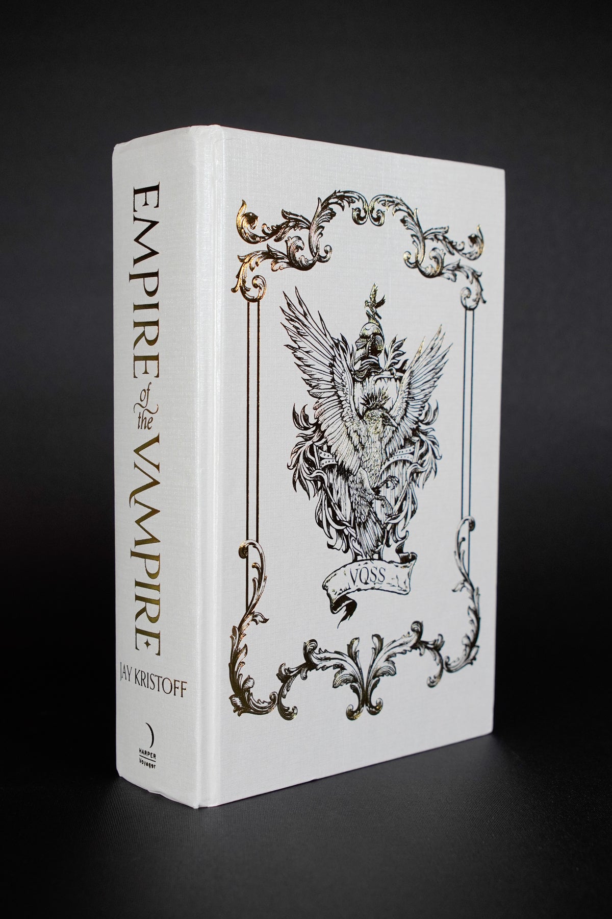 Empire of the Vampire Illumicrate: exposed front board and spine, showing compression at the spine ends and adjacent edge creasing