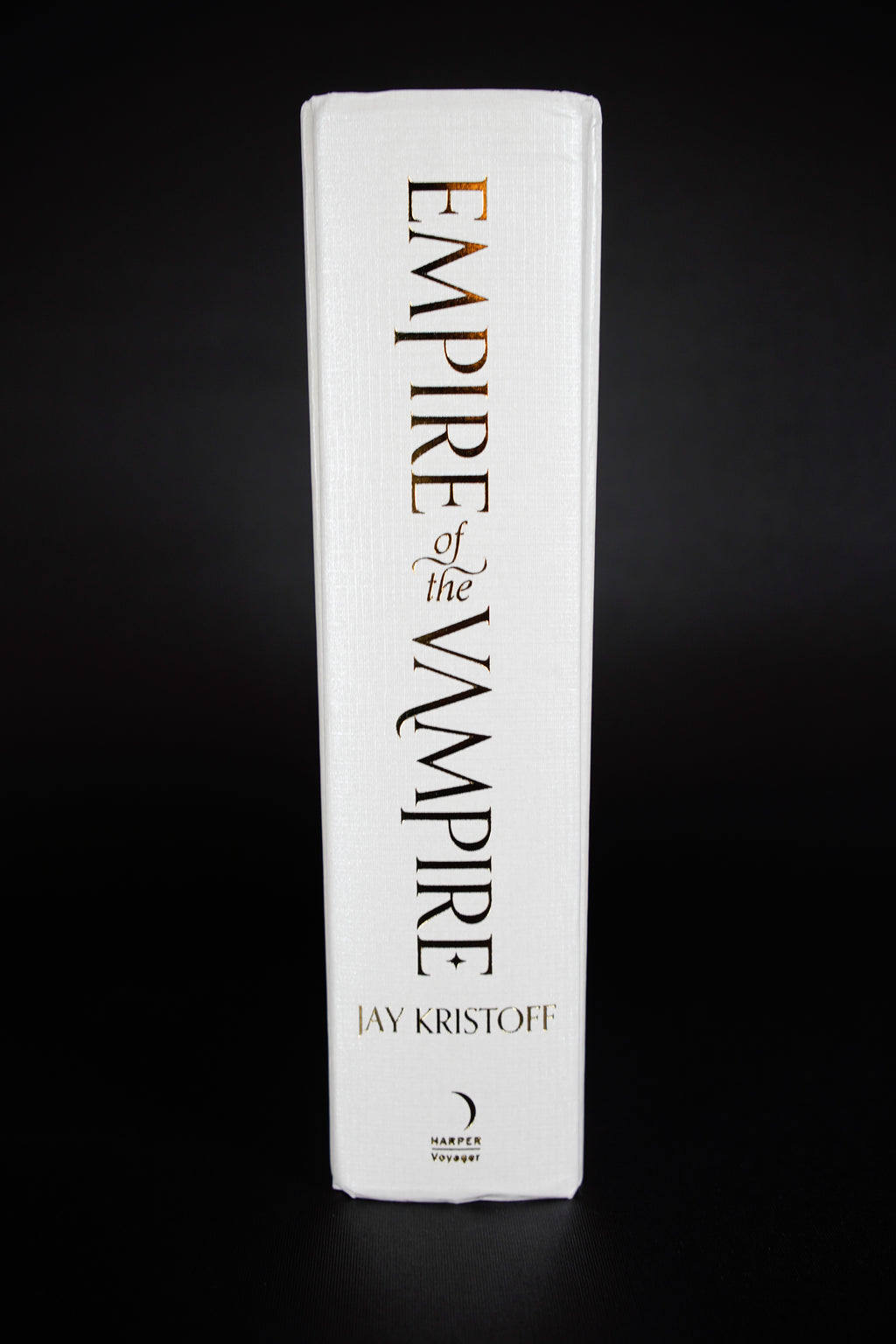 Empire of the Vampire Illumicrate: jacket removed, showing bumping and creasing at the upper and lower spine ends