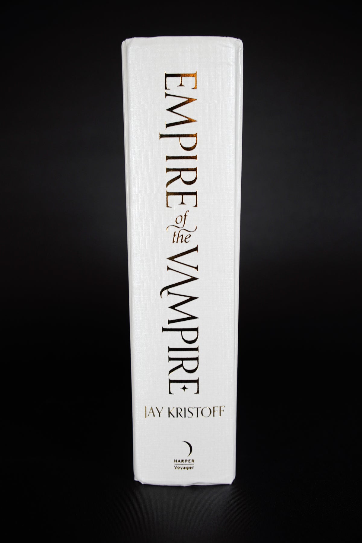 Empire of the Vampire Illumicrate: jacket removed, showing bumping and creasing at the upper and lower spine ends