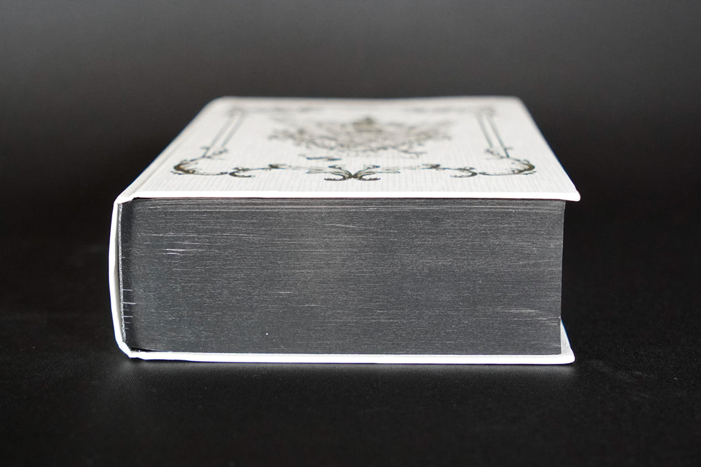 Empire of the Vampire Illumicrate: bottom edge view with jacket removed, showing damaged casing and board edges