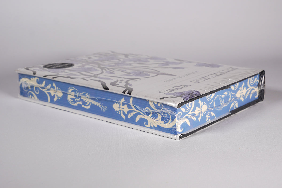 Three-sided stenciled page edges on the sealed Ruthless Vows OwlCrate edition