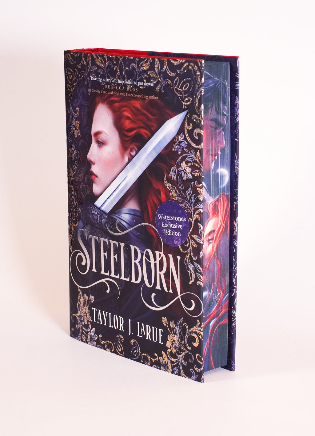 Steelborn Waterstones Exclusive Edition by Taylor J. LaRue, showing the dust jacket and illustrated page edges