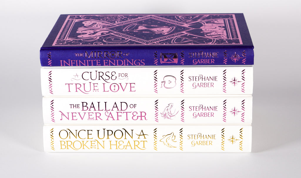 Stacked spines of four Stephanie Garber UK hardcovers including The Mirror of Infinite Endings