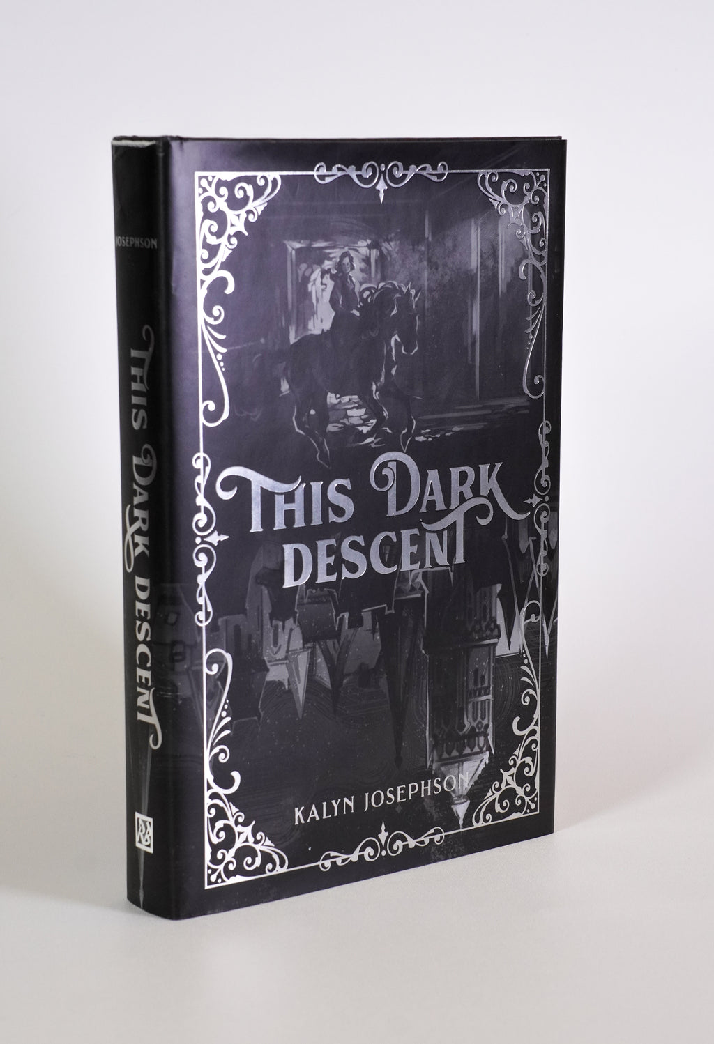 Front cover and spine of This Dark Descent by Kalyn Josephson, with silver foil details