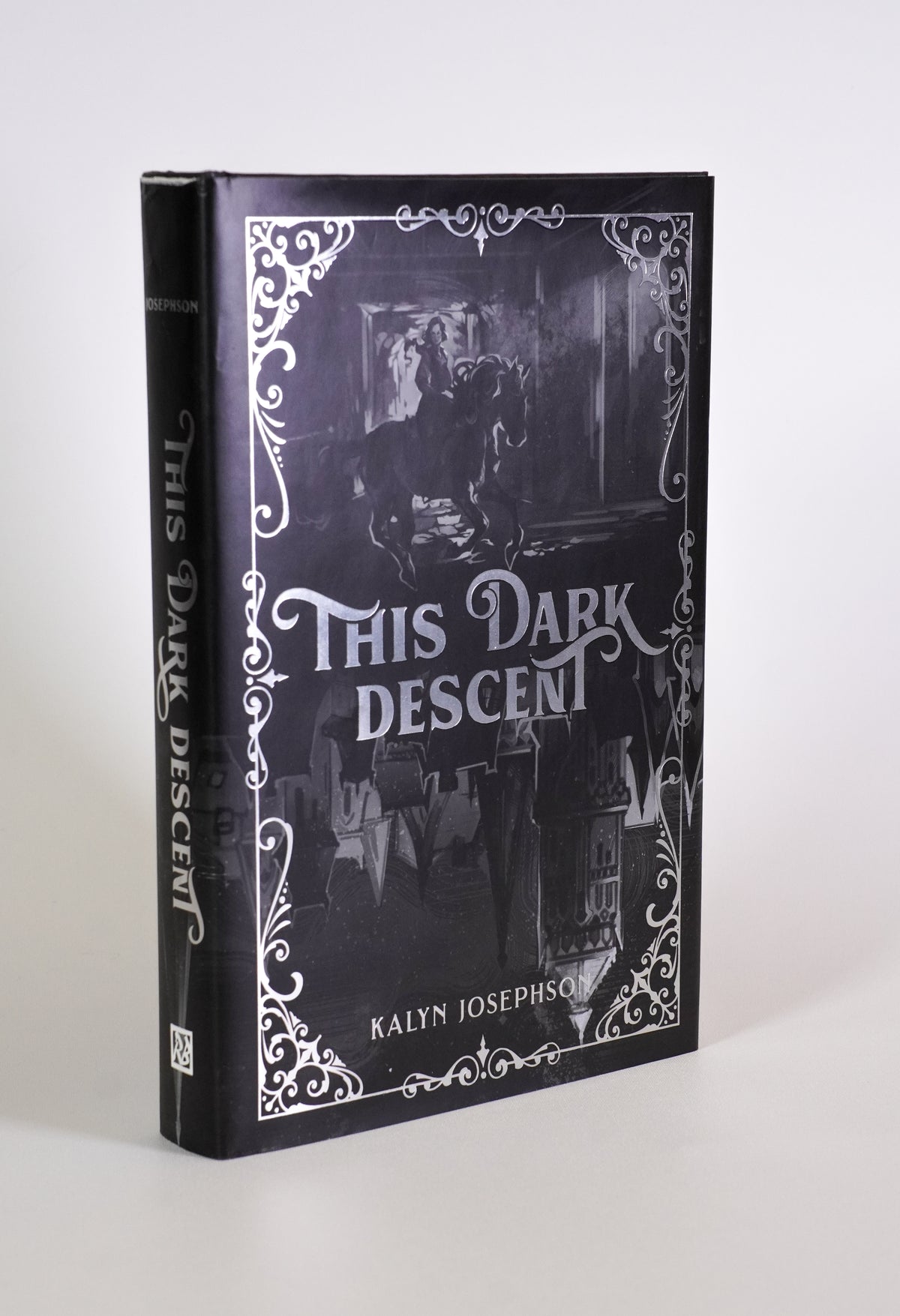 Front cover and spine of This Dark Descent by Kalyn Josephson, with silver foil details