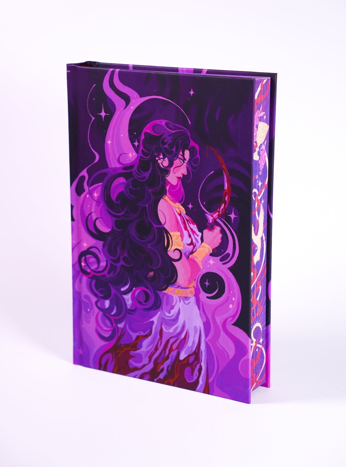 Verity Guild OwlCrate hardcover without its dust jacket, showing purple character artwork and illustrated page edges