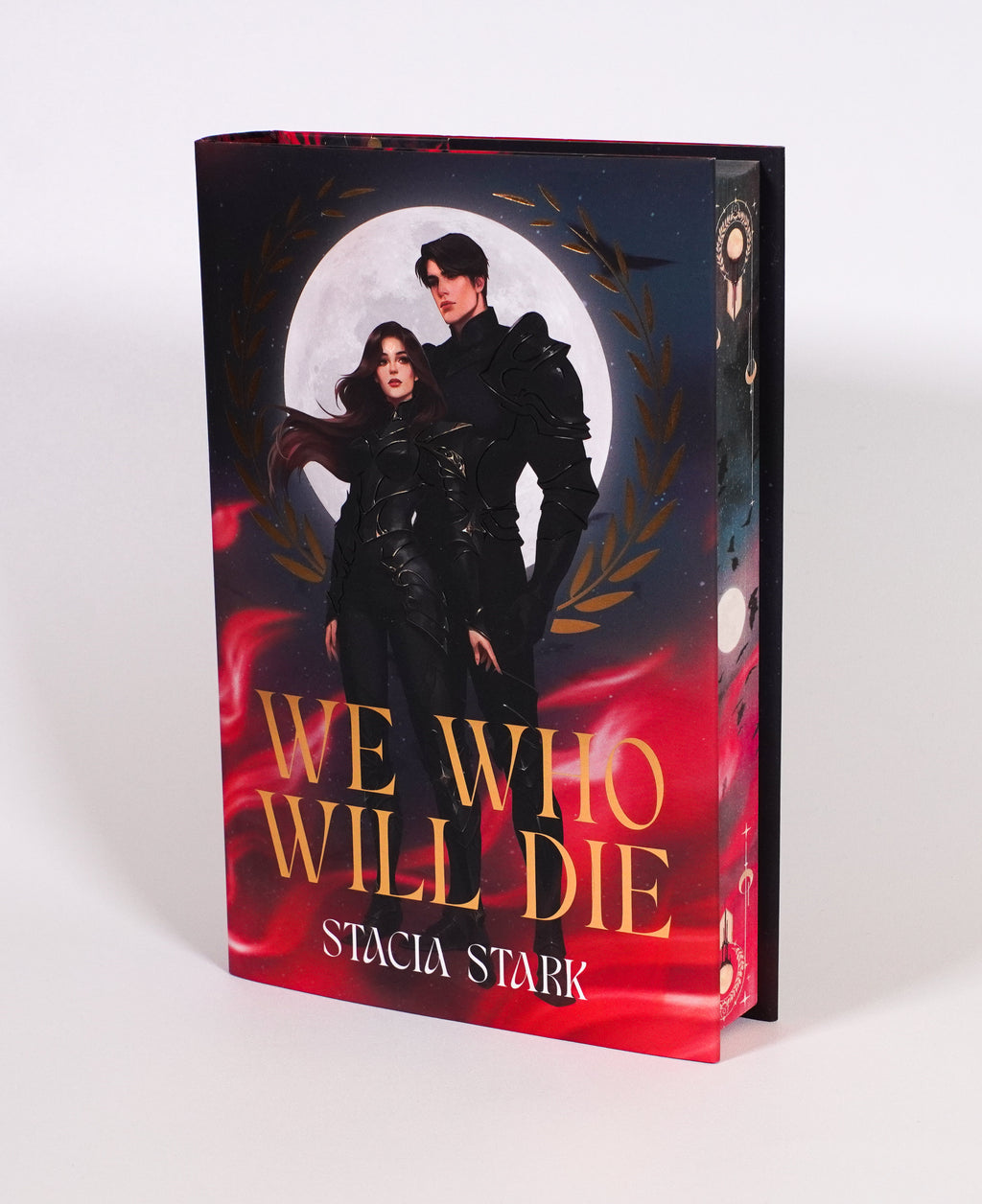 We Who Will Die FairyLoot edition, showing the character-art dust jacket and decorated fore-edge on a light background